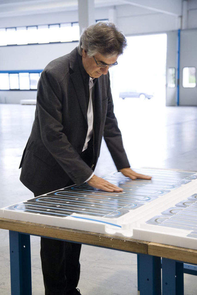 Roberto Messana looking at a Ray Magic® panel.