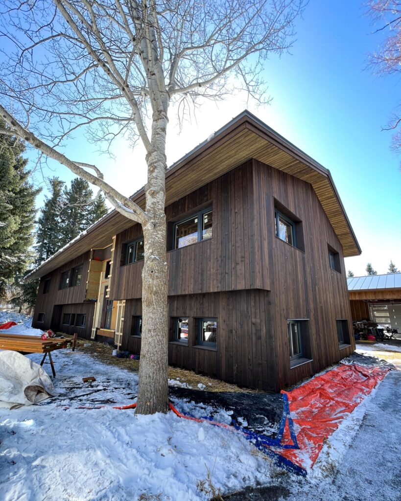 High-performance home in Bozeman, MT, that utilizes a radiant floor, radiant ceiling, and hydronic fan coil units.
