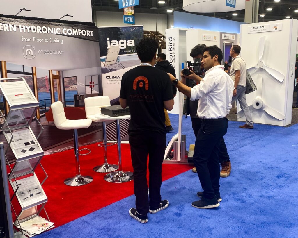 Saul explaining the benefits of modern hydronic solutions at IBS 2025