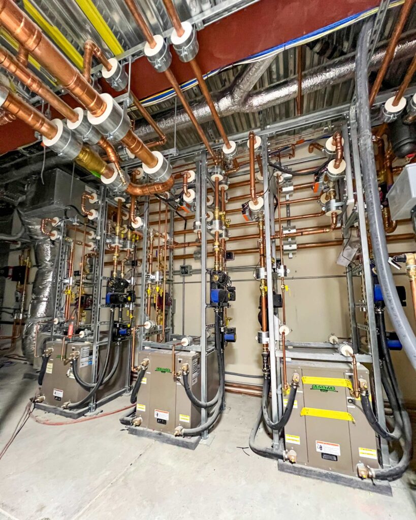 Three geothermal heat pumps, managed via Messana Controls, used for hydronic radiant heating and radiant cooling via a hydronic radiant floor.