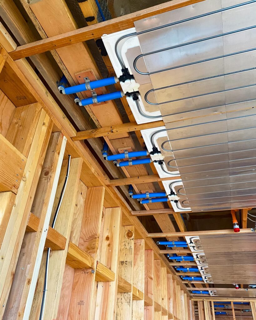 Ray Magic® NK radiant ceiling panels installed with pre-insulated PEX supply and return lines.